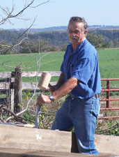 Click to view larger photo of Duane using the mallot and chisel